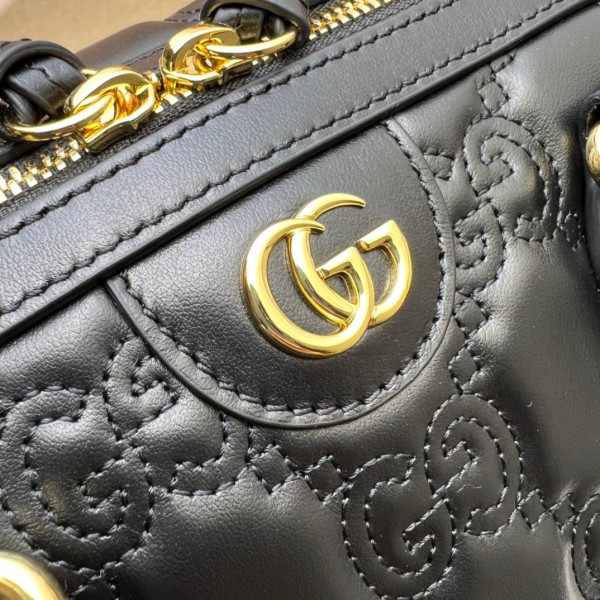 G*u*i gg matelassé leather top handle bag