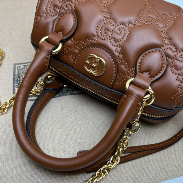 G*u*i gg matelassé leather top handle bag