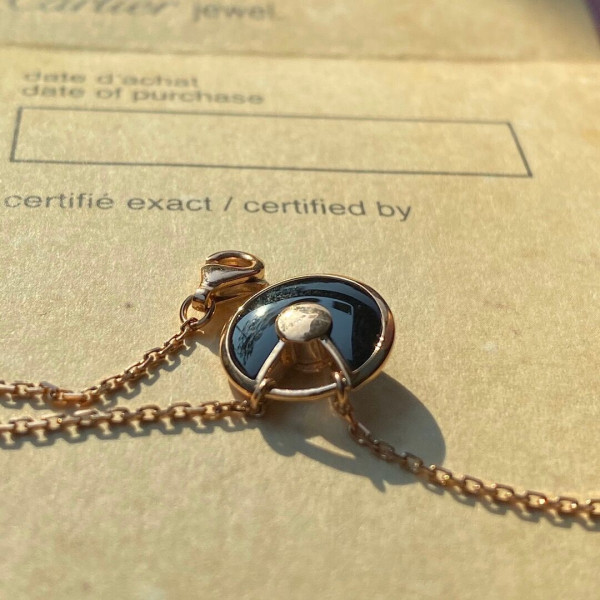 Ca*t*er  amulet necklace